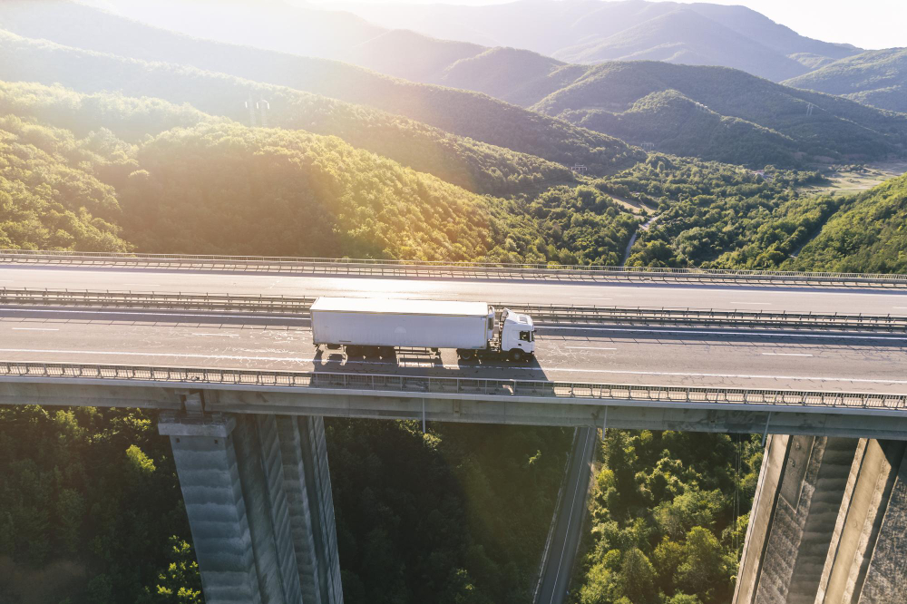 trucks highway mountain sunset
